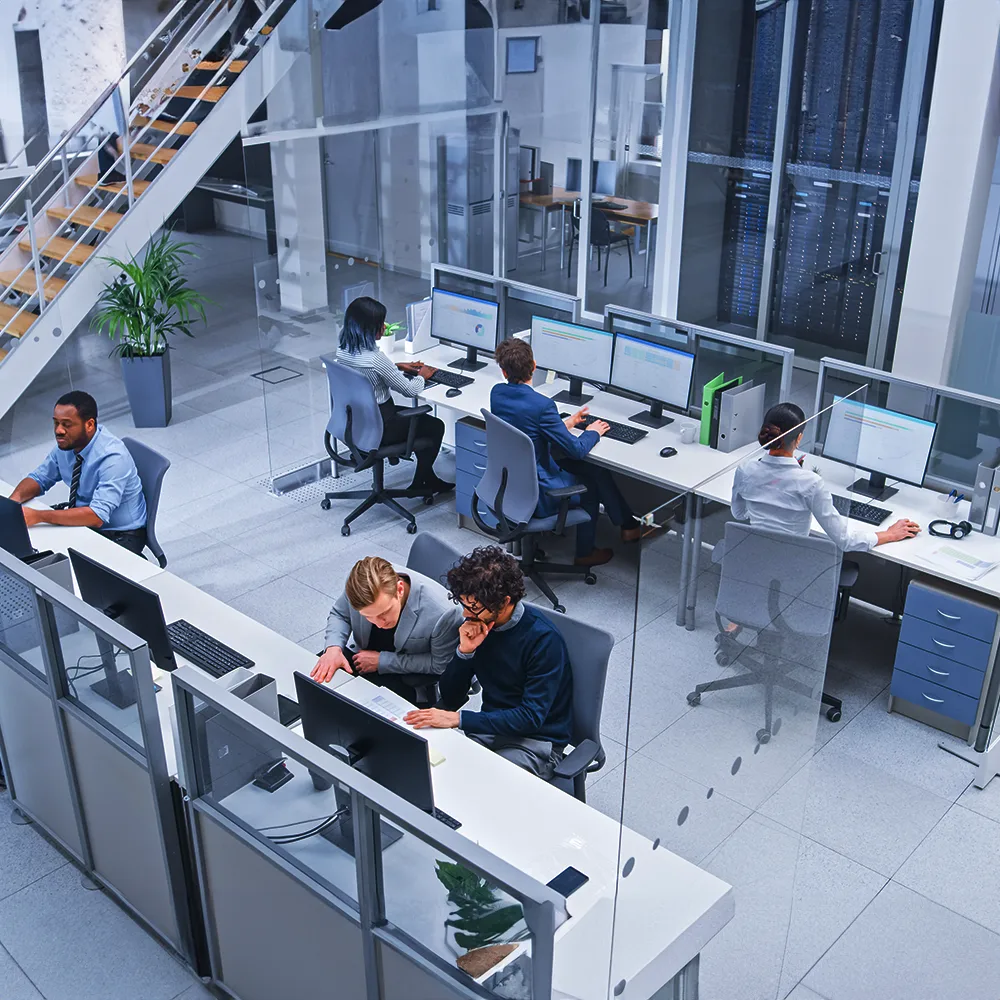 Open-plan office with employees at their workstations