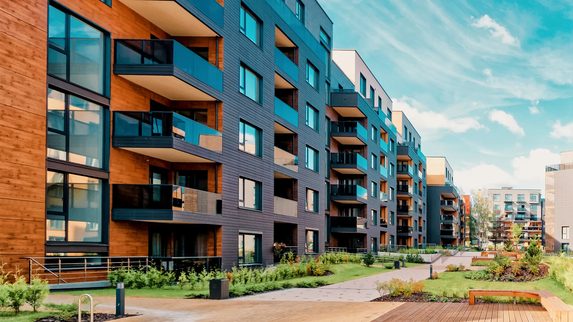Apartment buildings with shared outdoor spaces and landscaped walkways